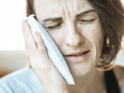 middle aged woman having toothache