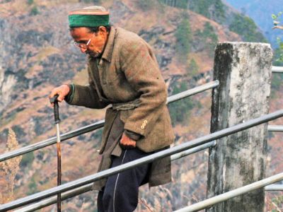 old man walking with cane